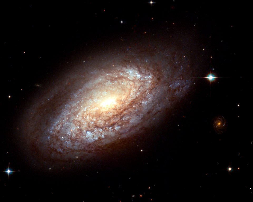 Galaxy NGC 2397 with an explosive secret