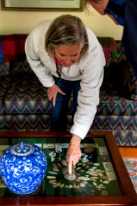 Marilyn shows off artifacts found on their property, arrowheads, tools, and more