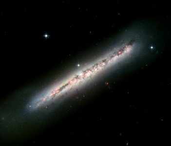 Glowing gas and dark dust in a side-on spiral