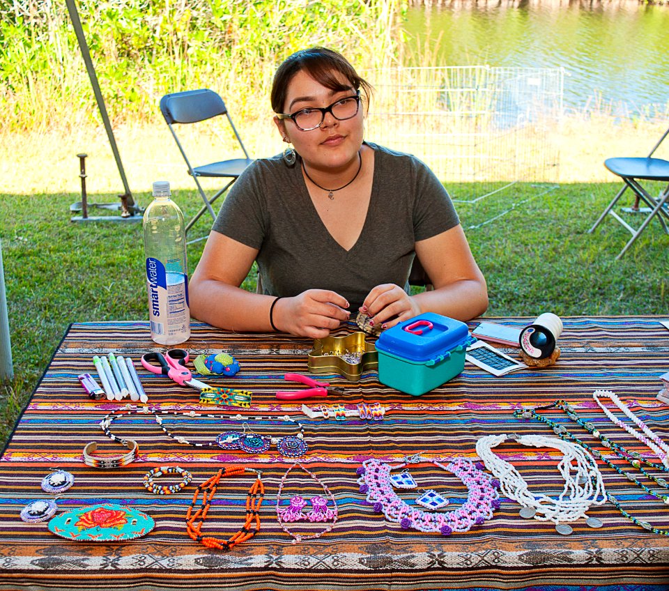 Randell doing Miccosoukee beadwork at their display
