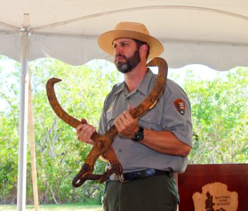NPS Ranger Brian holding one of the tongs loggers used