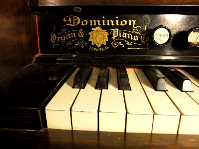 [Dominion label detail] Parlor reed organ