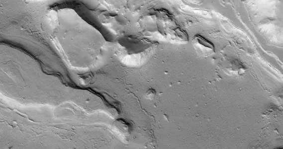 Layered Rocks and Cliffs on a Crater Floor