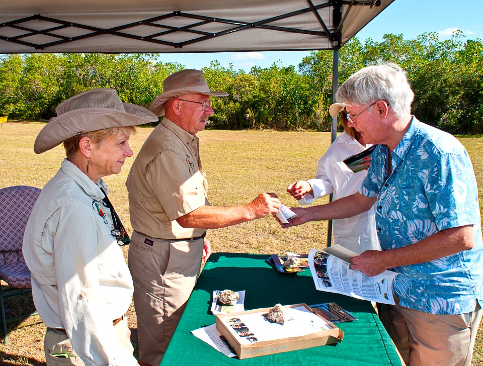 NPS volunteers Iris and Alex welcome Marianna and Bob to the Swamp Heritage Festival