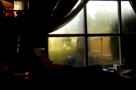 Wet windows, loft duplex, dark, Seattle, Washington, USA