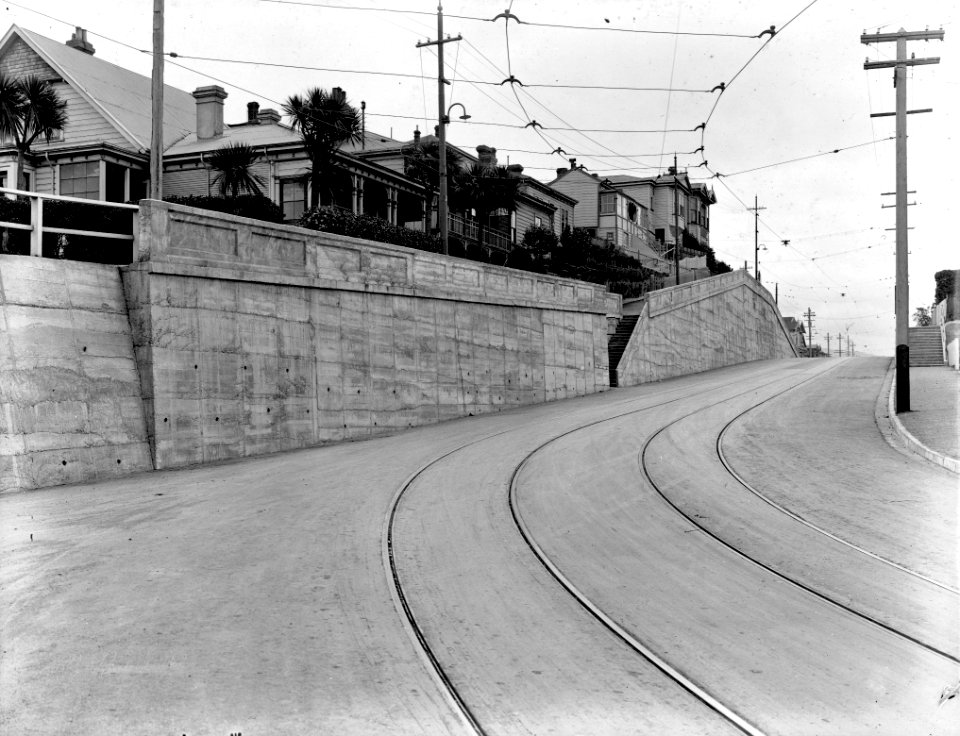 53- Wooden dwellings up on bank on right, tram tracks in road. Photograph of new asphaltic concrete surface., Wallace Street - Feb 1926