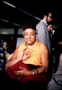 HH Dilgo Khyentse Rinpoche displaying the vitarka mudrā, Teaching, Giving Instruction, Reason, Preaching, Transmission of the Dharma mudra, after a visit to the Sakya Dharma Center, 1976, SeaTac Airport, Seattle, Washington, USA
