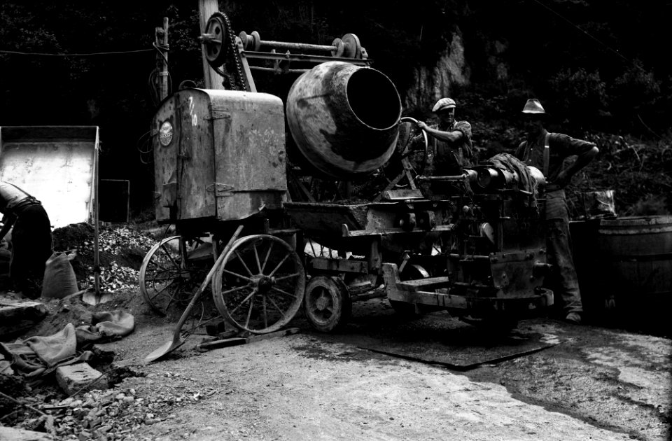 113; Glenmore Street, workmen pouring concrete into tipper on Lister Truck - 1932
