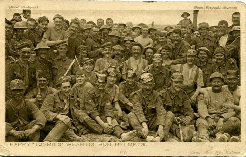 Happy "Tommies" wearing Hun helmets