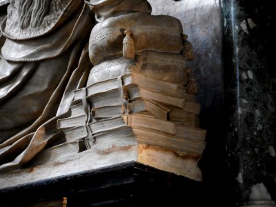 Books in Art - Detail of sepulchral monument of Silvestro Aldobrandini (†1558), pope Clement VIII's father, with statue by Nicolas Cordier (Saint-Mihiel, about 1567-Rome 1612) - Santa Maria sopra Minerva Church in Rome photo