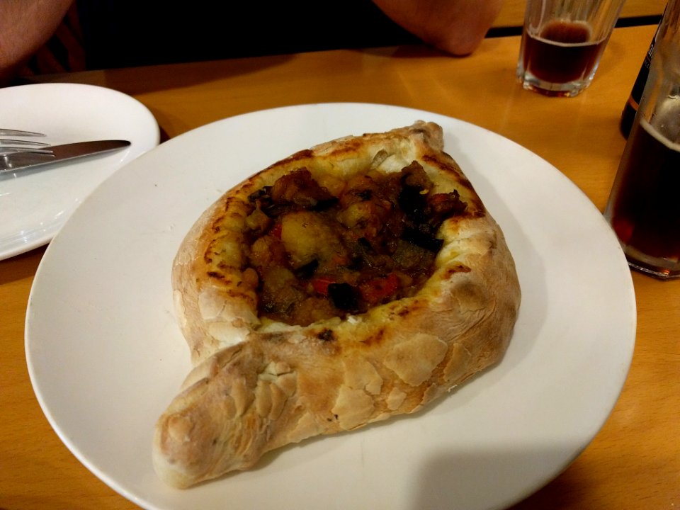 Fasting food eggpant in a bread boat Tbilisi Georgia