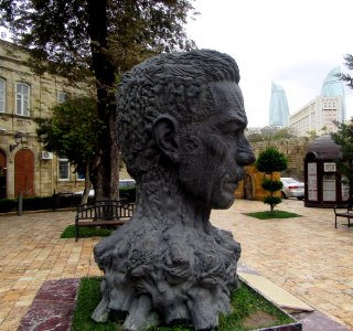 Bust of Vahid the poet with characters in his hair Baku Azerbaijan photo
