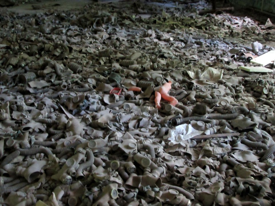 Pile of gas masks on school floor Pripyat Chernobyl exclusion zone Ukraine
