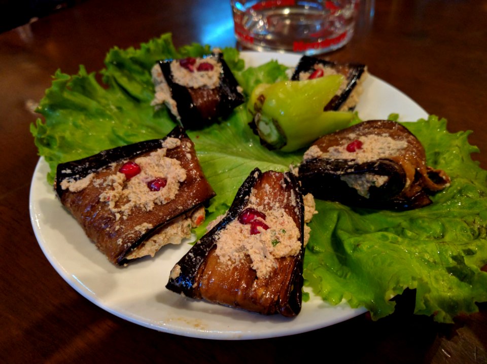 Badrijani or nigvzit aubergine with walnut and garlic paste Georgia