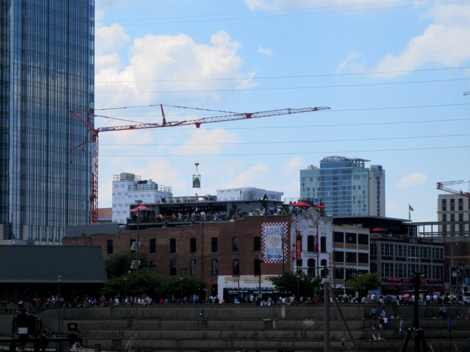 Crane with people watching eclipse Nashville Tennessee
