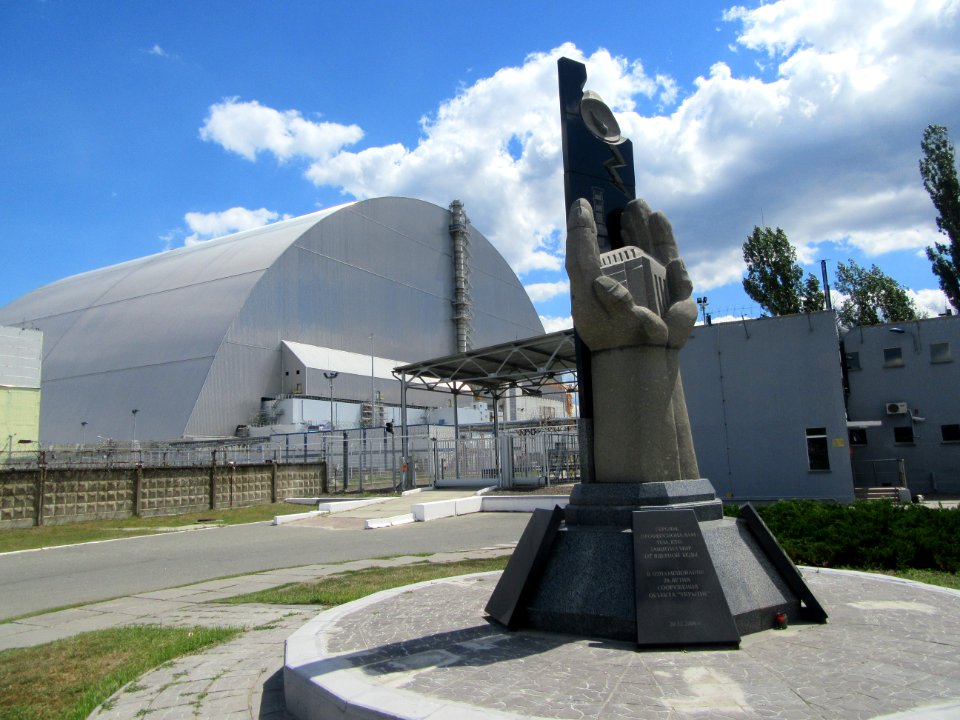 Memorial to commerarate the 20th anniversary of the first sarcophogus of dome in front of the new sarcophogus right over reactor 4