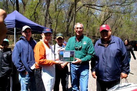 Longtime Volunteer of Kid's Fishing Day, Bob Jackson, Recieves Plaque of Appreciation from Regional Director Tom Melius photo
