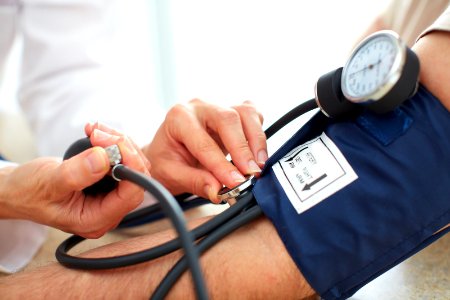 Blood pressure measuring. Doctor and patient. Health care. photo