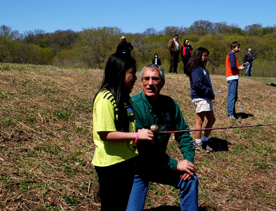 Regional Director Tom Melius Talks with Student About Fishing