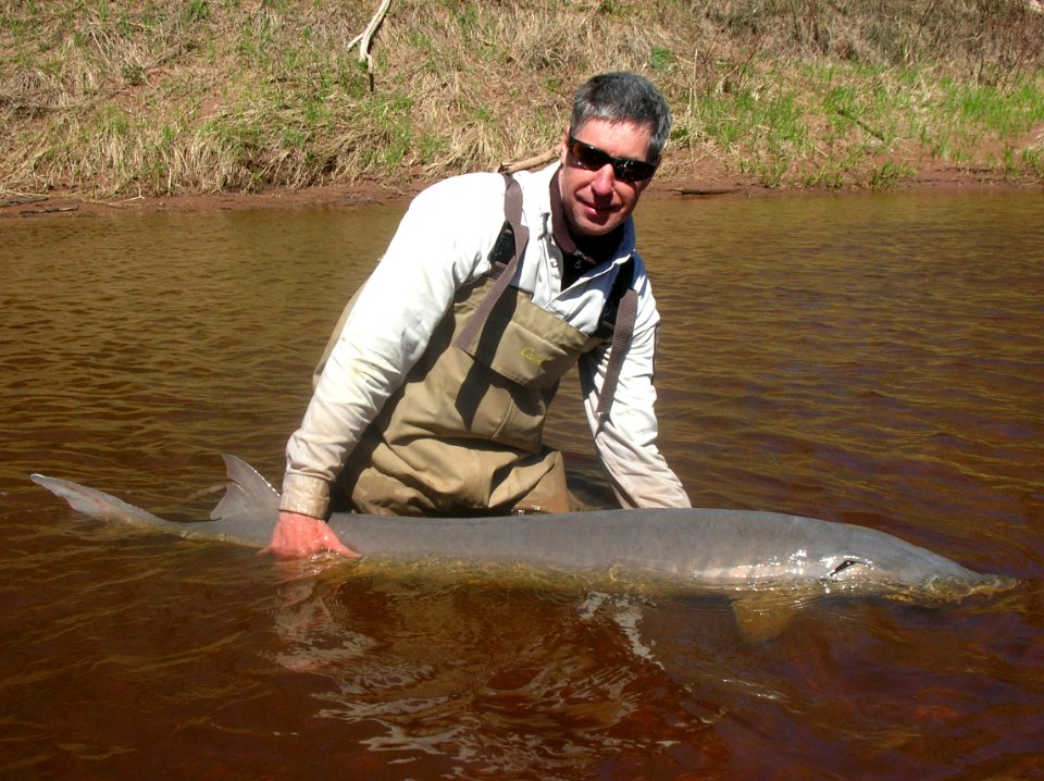 Henry Quinlan with 74 lb adult Lake Sturgeon