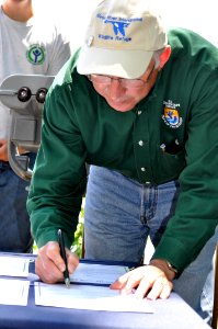 Secretary Salazar signs acquisitions photo