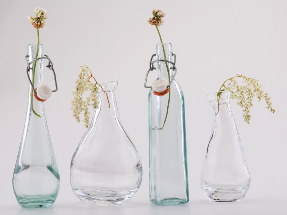 Bottles flowers glasses