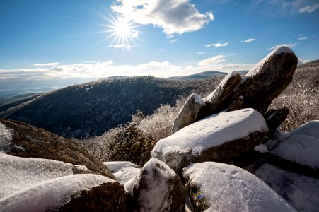 Sunlight Shines on Snowy Rocks photo