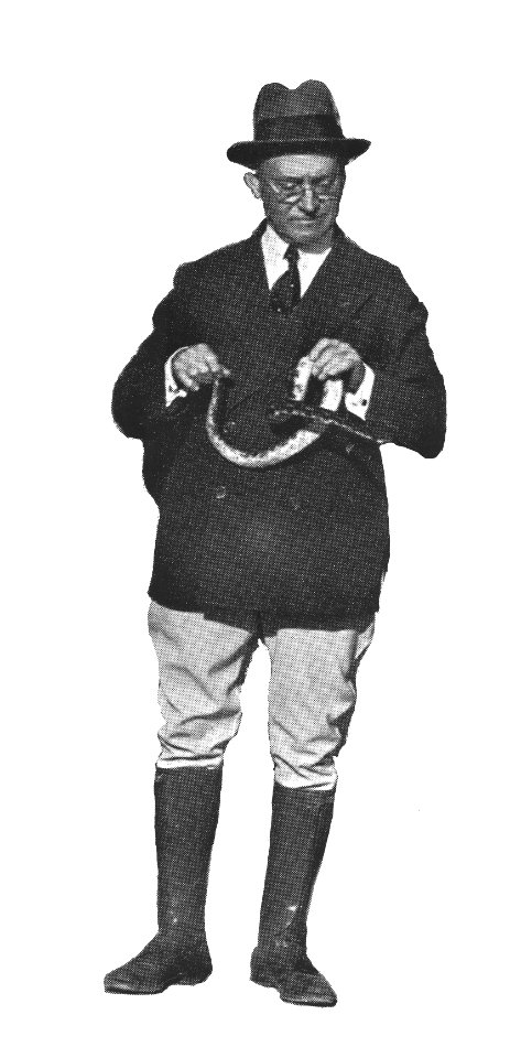 George F Pollock handing rattlesnake