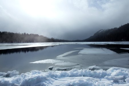 Snow along bank of Suttle Lake, Oregon photo
