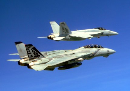 A Grumman F-14B ''Tomcat'' and a Boeing F/A-18E ''Super Hornet'