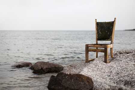 Shore pebbles beach chair photo
