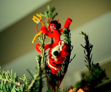 Santa fighting Devil on Christmas Tree photo