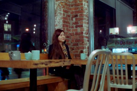 Smirking at a Cafe