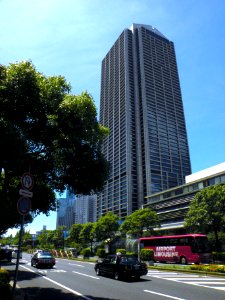 City hall and a red limousine