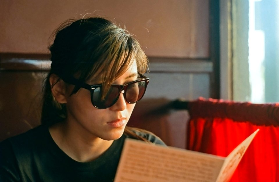 girl reading menu at Cheesecake Etc