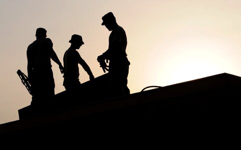 Hardhats silhouettes building photo