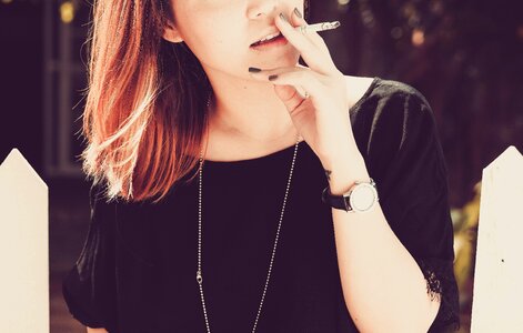 Female smoking cigarette photo