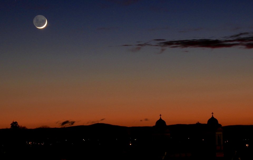 Sunrise with crescent moon