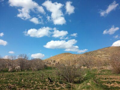 Hills field clouds photo