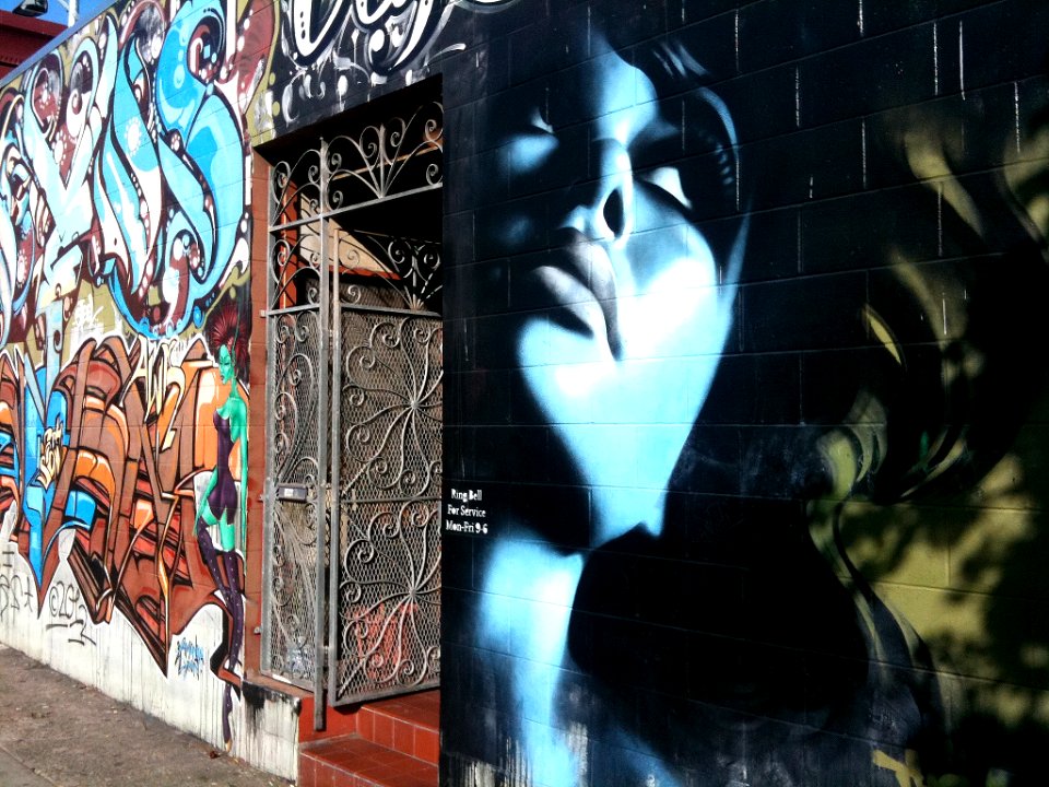 she emerges from the wall (graffiti girl)