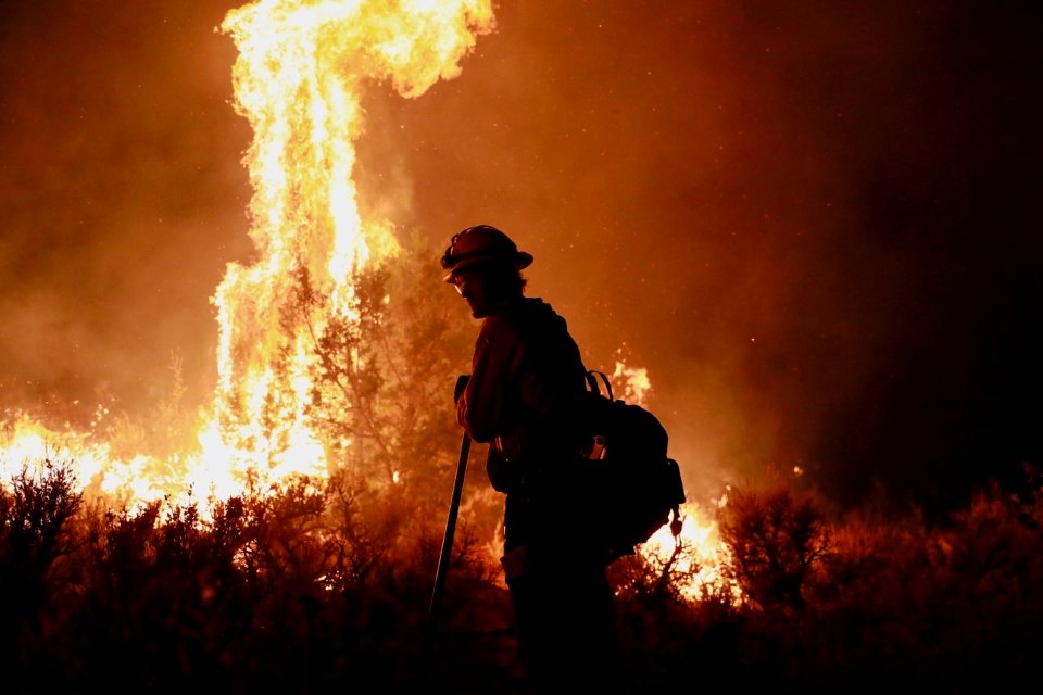 Firefighter holding the line.