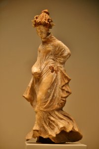 Terracotta Statuette of a Dancer, Greek made in Taras, South Italy, 300-200 BC, Getty Villa, Malibu, California.