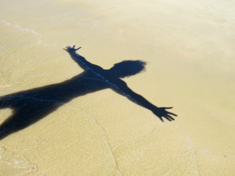 Sand by sunsets ocean
