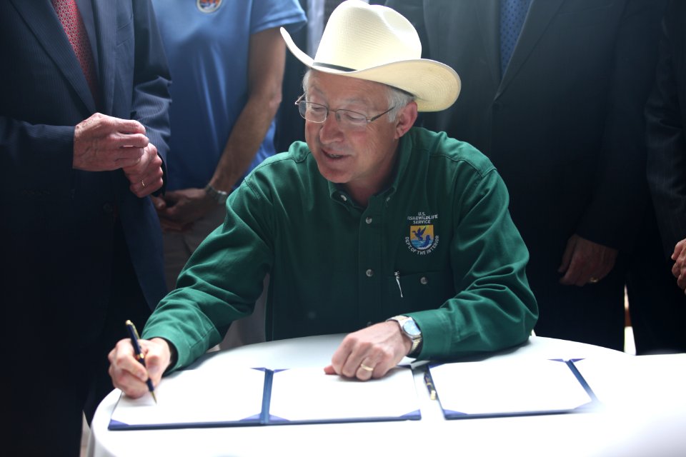 Salazar Signs Document