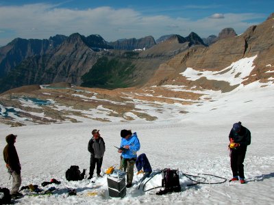 Scientists recording data on Sperry Glacier