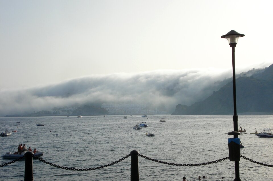 Sea boats mountains