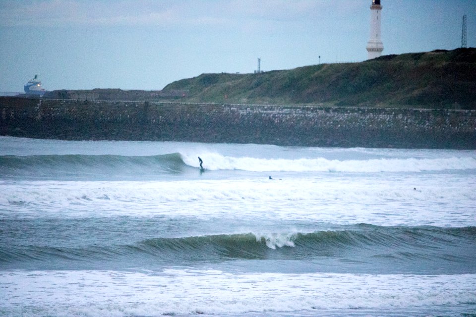 Surfers on Aberdeen Harbour in the Evening