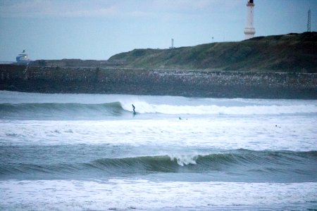 Surfers on Aberdeen Harbour in the Evening photo