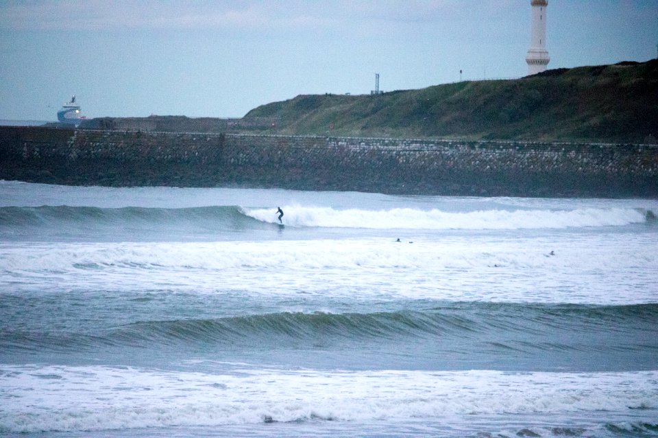 Surfers on Aberdeen Harbour in the Evening