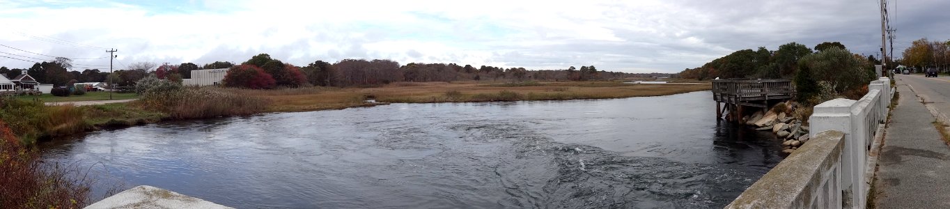 View of the tidal river and coastal salt pond from Parkers River Bridge